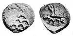 Coin of Agathocles. Obv Stupa surmounted by a star, Kharoshthi legend Akathukreyasa "Agathocles". Rev vegetal symbol and hirañasame (185-168 BCE).