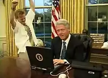 President Bill Clinton (right) with television actor Mike Maronna (left) celebrating a successful online purchase in a comedic short film recorded for the 2000 Dinner.