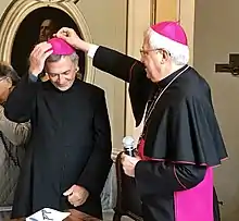 Egidio, just named a bishop, receives the zucchetto from bishop Maurizio Malvestiti, 29 September 2017