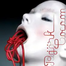 Up-close face image of a white woman with her mouth open whilst red wires are coming out of it. She has pink-blushed cheeks, and wears blue marcara on her eyes. On the right of the image the words "Björk" and "Cocoon" are written in red.