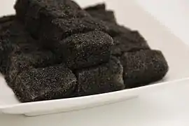 Injeolmi coated with heugimja-gomul (black sesame powder)