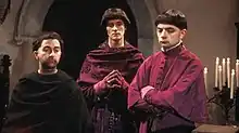 Prince Edmund, Baldrick and Lord Percy in purplse clerical cassocks
