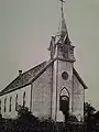 The original wood-frame church in Butler City.