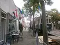 Temporary train near fish and chips shop during autumn festival.