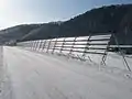 Blow-off snow fence (Refrain-fixed snow plate type)