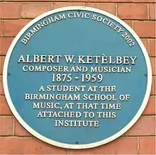 Plaque bearing the legend "Albert W Ketèlbey composer and musician 1875–1959 a student at the Birmingham school of music, at that time attached to this institute"