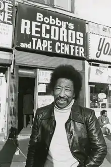Robinson in front of his record store, 1977.