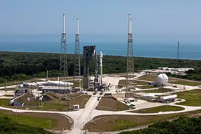 CST-100 Starliner spacecraft and Atlas V rocket roll out from the Vertical Integration Facility to the launch pad