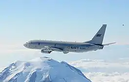 Boeing P-8I in flight over mountains