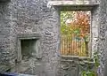 The old fireplace and the viewing or projection window from the inside.