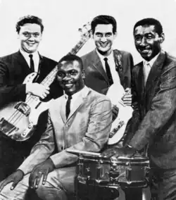 Booker T. & the M.G.'s c. 1967 (L–R): Donald "Duck" Dunn, Booker T. Jones (seated), Steve Cropper, Al Jackson Jr.