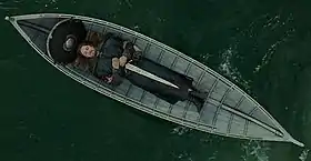 Still from Peter Jackson film showing a boat funeral
