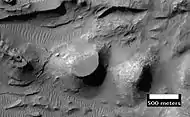 Close up of layers in eroded deposits on the floor of Bouguer Crater, as seen by HiRISE.  This image is in a different part of the crater than the CTX image to the right.