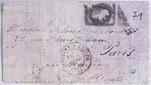 Color photograph of a letter envelope with partially faded lettering.