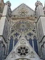 The flamboyant Grand Housteau and west rose window