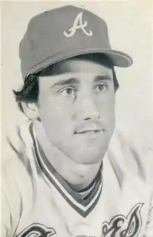 A black and white photograph of a baseball player