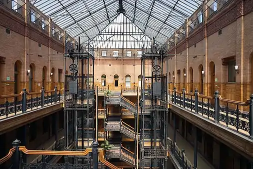 Interior of the Bradbury Building, with its exposed staircases and free-standing hydraulic elevators, Los Angeles, USA, by George Herbert Wyman, 1889-1893