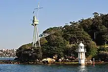 Bradleys Head Light on the right. Foremast of HMAS Sydney on left