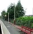 Looking down the platform, away from the station building. The posts with the yellow bands are for new CCTV equipment for use by train drivers.