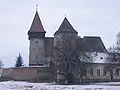 The medieval Evangelical Lutheran Transylvanian Saxon fortified church of Brateiu/Pretai in winter