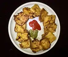 Bread pakora, made by deep-frying bread slices coated with gram flour