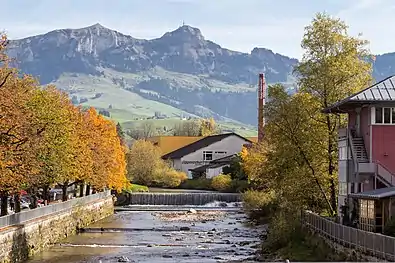 Distillery "Appenzeller Alpenbitter" at the river Sitter and the mountain Hoher Kasten in the background