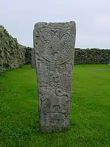 A replica of the Pictish Bressay Stone in St Mary's churchyard where the original stone was found.