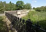 Bridge over Lake and attached Railings approx. 250 Metres North of Walton Hall