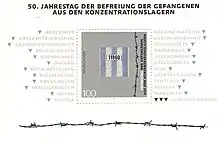 A 1995 German stamp (worth 1 Deutschmark), printed on white paper. On top, the text in German reads "50th anniversary of the liberation of prisoners from the concentration camps". A stylised fragment of prisoner's clothes and some barbed wire appear in the post stamp area; the sheet containing it additionally includes names of concentration and extermination camps, including KL Warschau