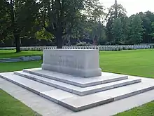 A rectangular stone on a multi-stepped stone platform. the words "Their name liveth for evermore" inscribed on the longer side of the stone.