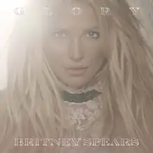 The album's original cover features a close-up image of Spears with a bright light in the background. The album title is written on top of the image, while Spears's name is written below her image.