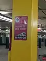 Signs pointing towards PATCO trains