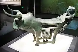 Dian bronze table in the shape of an ox protecting its calf from a tiger