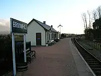 A view of the platform and station buildings looking towards Boat of Garten