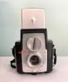 A Brownie Starflex camera with the cover for its finder window popped up.