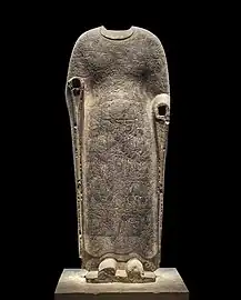 Buddha Vairocana draped in robes portraying the Realms of Existence. Limestone, Northern Qi, between 550 and 577
