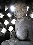 A Buddha statue inside a stupa