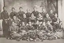A photograph of Tsarevna Miladinova, the founder of the first Buglarian girls' school in Thessaloniki, with teachers and students at the school.