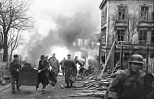 Burning and damaged houses after explosion in Vågen, Bergen on 20 April 1944