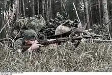 German soilders with a capture SVT-40 rifle