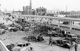May 1940: Destroyed vehicles at Calais railway station.