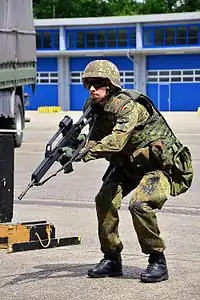 A German soldier holding his G36