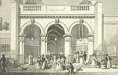 The entrance to Burlington Arcade, showing three tall arches.