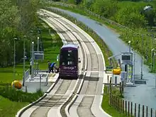 Image 208Kerb-guided track and adjacent multi-user path along a disused rail line, on the Leigh-Salford-Manchester Bus Rapid Transit (from Guided bus)