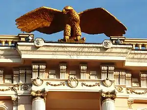 The eagle, emblem of the hotel set at the top of the frontage