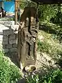 Pillar style khachkar with a Maltese Cross located behind a house in the village.