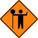 TC-21Traffic control flagger ahead