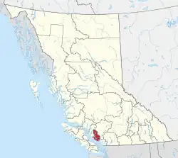 A map of British Columbia depicting its 29 regional districts and equivalent municipalities. One is highlighted in red.