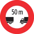 2.47 Minimum distance between large goods vehicles (total weight is larger than 3.5 t) required (if valid for a longer distance, then additional length information is shown below the sign: panel 5.03)