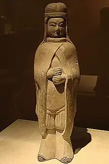 Female xianbei warrior wearing a cloak and xianbei hat, Northern Wei dynasty.
